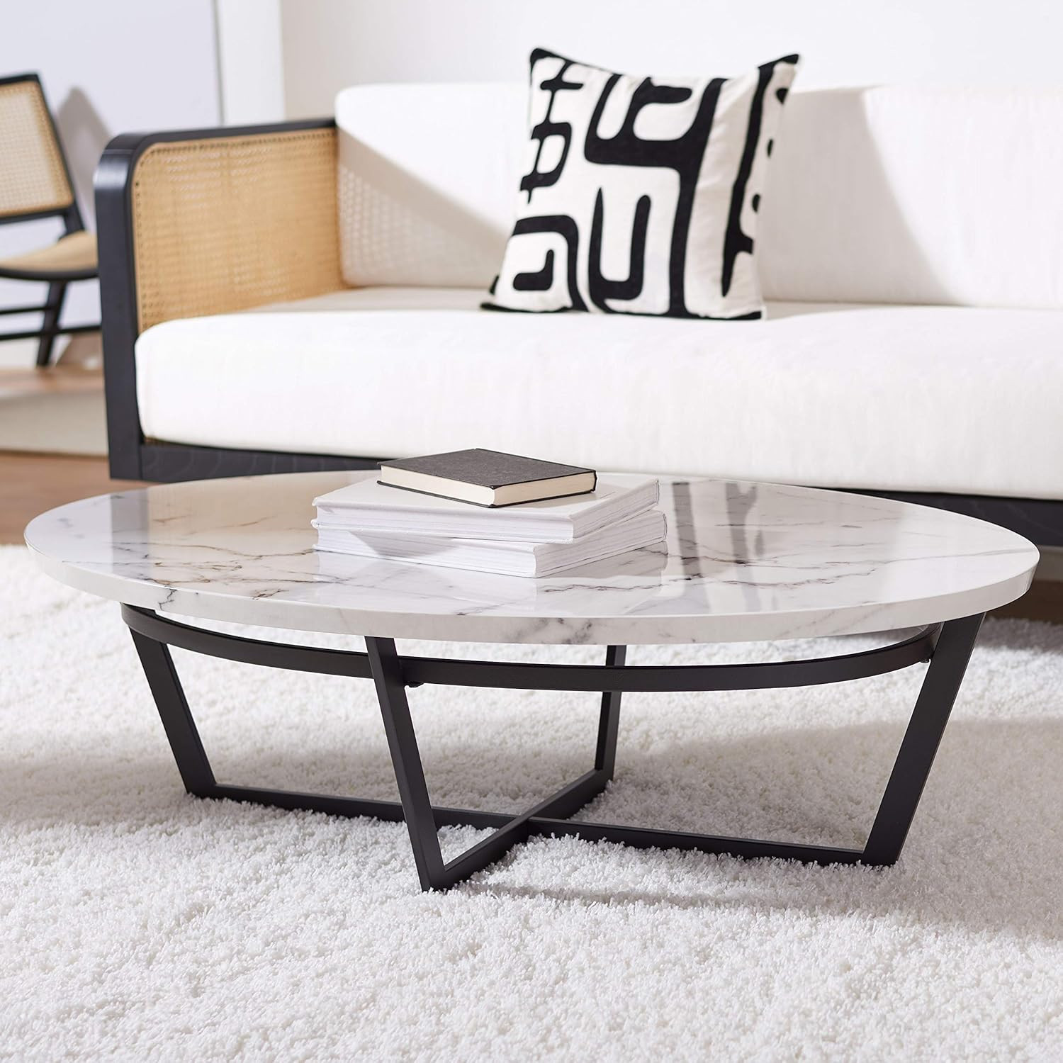 Sleek Oval Coffee Table with White Marble Top and Stylish Black Base